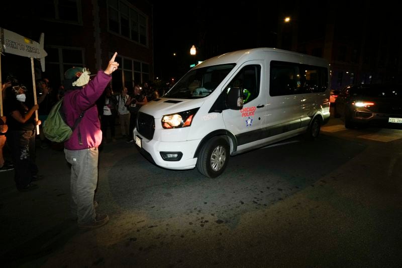 Protesters try to block traffic after a demonstration outside the Democratic National Convention Thursday, Aug. 22, 2024, in Chicago. (AP Photo/Julio Cortez)