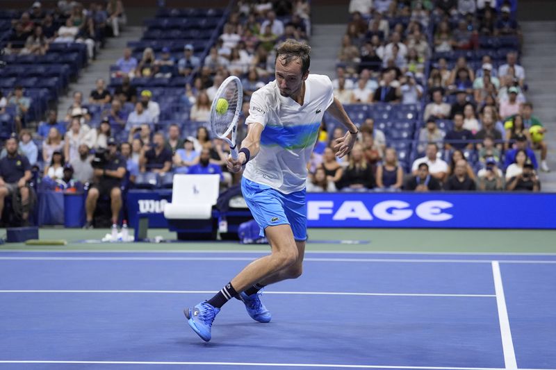 Daniil Medvedev, of Russia, returns a shot to Flavio Cobolli, of Italy, during the third round of the U.S. Open tennis championships, Saturday, Aug. 31, in New York. 2024. (AP Photo/Matt Rourke)