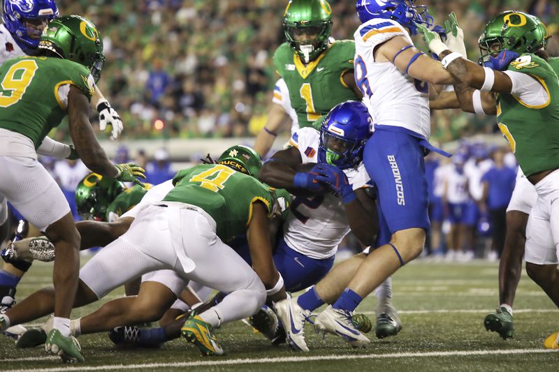 Boise State running back Ashton Jeanty (2) pushes over the line for a touchdown during the second half of an NCAA college football game against Boise State, Saturday, Sept. 7, 2024, at Autzen Stadium in Eugene, Ore. (AP Photo/Lydia Ely)