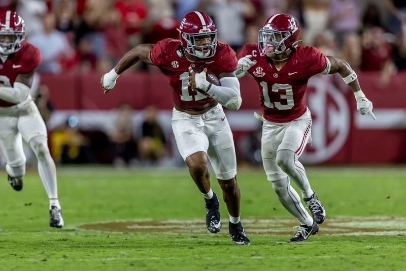 Alabama linebacker Jihaad Campbell (11) returns an interception against Georgia as Alabama defensive back Malachi Moore (13) trails the play during the first half of an NCAA college football game, Saturday, Sept. 28, 2024, in Tuscaloosa, Ala. (AP Photo/Vasha Hunt)