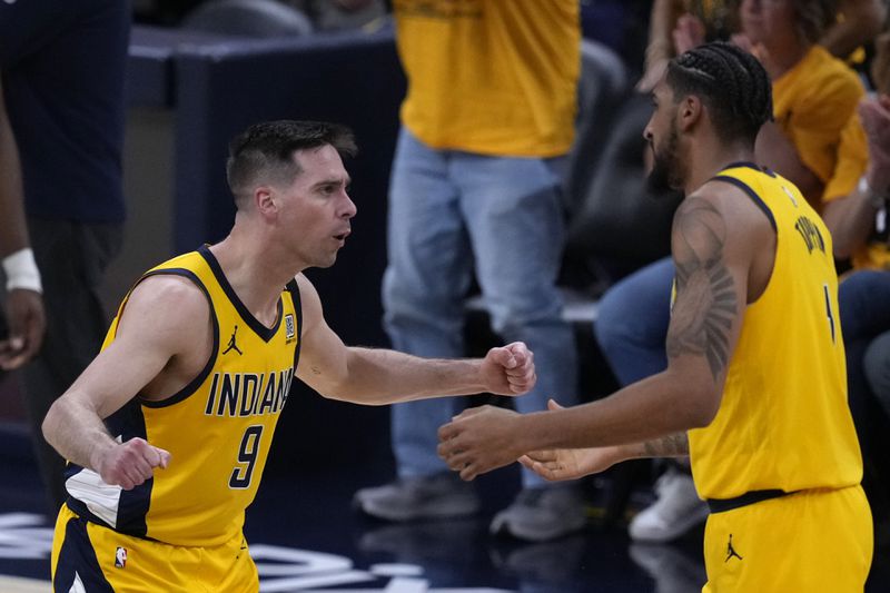 Indiana Pacers guard T.J. McConnell (9) celebrates with teammate forward Obi Toppin, right, during the first half of Game 3 of the NBA Eastern Conference basketball finals against the Boston Celtics, Saturday, May 25, 2024, in Indianapolis. (AP Photo/Darron Cummings)