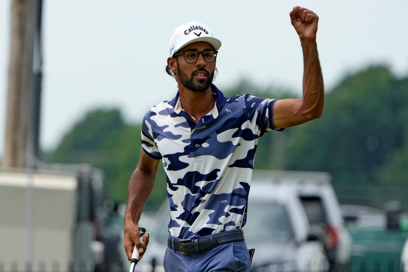 Akshay Bhatia reacts after sinking a putt on the eighth hole during the final round of the Travelers Championship golf tournament at TPC River Highlands, Sunday, June 23, 2024, in Cromwell, Conn. (AP Photo/Seth Wenig)