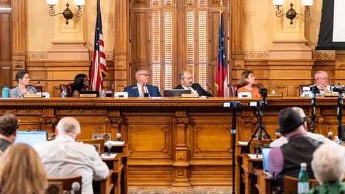 Members of the State Election Board listen to public comment during a meeting Tuesday at the Georgia Capitol in Atlanta.