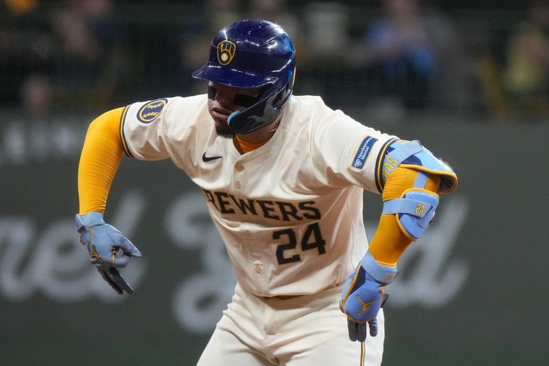 Milwaukee Brewers' William Contreras reacts after hitting a two-run scoring double during the third inning of a baseball game against the Philadelphia Phillies Monday, Sept. 16, 2024, in Milwaukee. (AP Photo/Morry Gash)