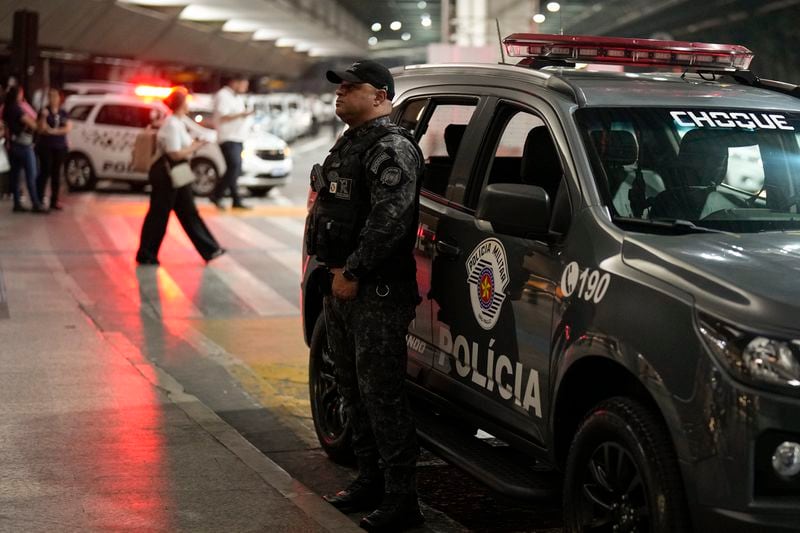 A policeman stands guard during the arrival of the Green Bay Packers at Sao Paulo International airport ahead of a game against the Philadelphia Eagles, in Guarulhos, greater Sao Paulo, Brazil Wednesday, Sept. 4, 2024. (AP Photo/Andre Penner)