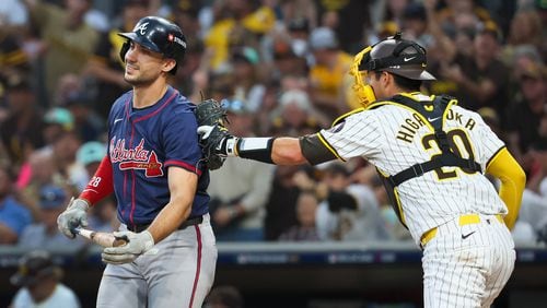 Atlanta Braves’ Matt Olson (28) strikes out and tagged by San Diego Padres catcher Kyle Higashioka (20) during the third inning of National League Division Series Wild Card Game One at Petco Park in San Diego on Tuesday, Oct. 1, 2024.   (Jason Getz / Jason.Getz@ajc.com)