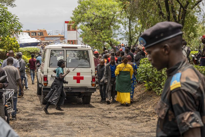 An ambulance arrives at the port of Goma, Democratic Republic of Congo, after a ferry carrying hundreds capsized on arrival Thursday, Oct. 3, 2024. (AP Photo/Moses Sawasawa)