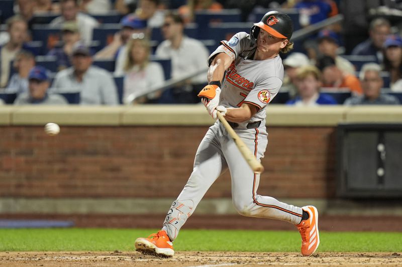 Baltimore Orioles' Jackson Holliday hits a run scoring ground out during the fifth inning of a baseball game against the New York Mets at Citi Field, Monday, Aug. 19, 2024, in New York. (AP Photo/Seth Wenig)