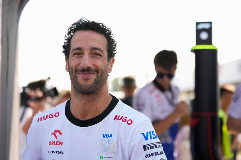 Daniel Ricciardo of Australia driver of RB, the team previously known as AlphaTauri arrives ahead of the first free practice at the Monza racetrack, in Monza, Italy, Thursday, Aug.30 , 2024. The Formula one race will be held on Sunday. (AP Photo/Luca Bruno)