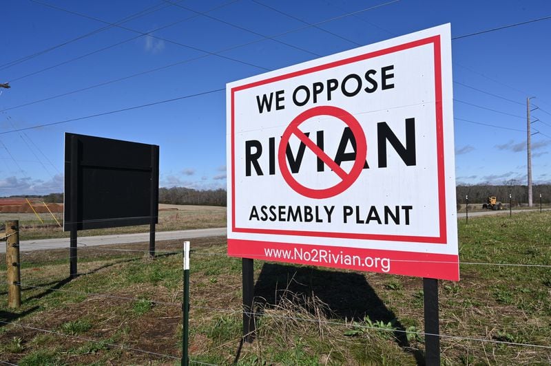 December 15, 2022 Social Circle - Signs to oppose the Rivian Assembly Plant are seen at Old Mill Road and Davis Academy Road near the 2,000-acre Rivian factory site in southern Walton and Morgan counties on Thursday, December 15, 2022. (Hyosub Shin / Hyosub.Shin@ajc.com)