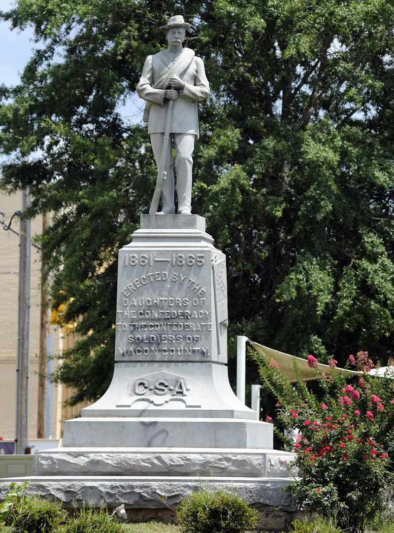 After nationwide protests over the alleged police killing of George Floyd and an attack on the monument by vandals, the chairman of the Macon County Commission said officials will cover the memorial with a tarp and are looking for ways to remove it in Alabama.