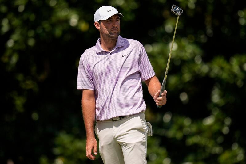 Scottie Scheffler watches his putt on the second green during the first round of the Tour Championship golf tournament, Thursday, Aug. 29, 2024, in Atlanta. (AP Photo/Mike Stewart)