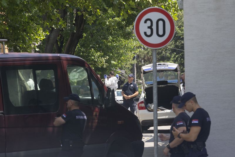 Police officers work at a crime scene close to the Israeli embassy in Belgrade, Serbia, Saturday, June 29, 2024. An attacker with a crossbow wounded a Serbian police officer guarding the Israeli Embassy in Belgrade. Serbia’s interior ministry says the officer responded by fatally shooting the assailant. (AP Photo/Marko Drobnjakovic)