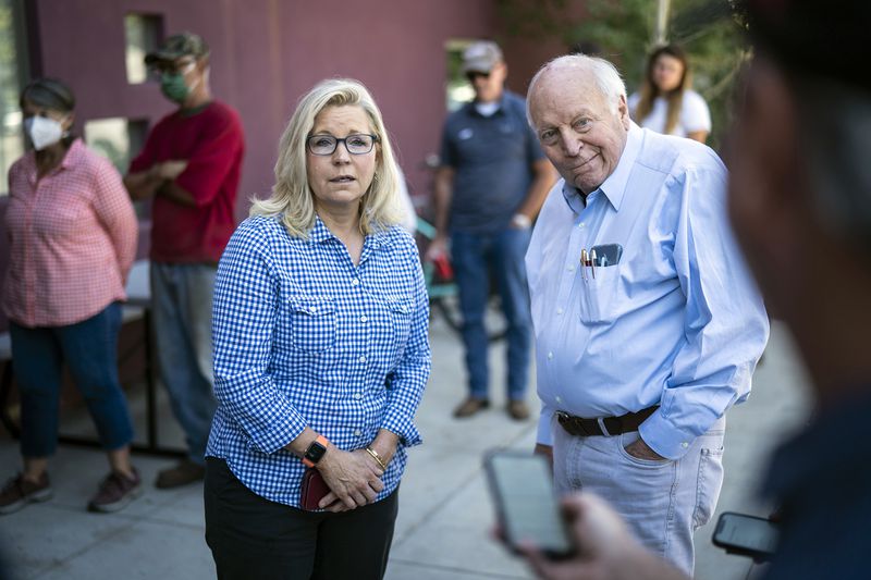 FILE - Rep. Liz Cheney, R-Wyo., arrives, with her father, former Vice President Dick Cheney, to vote at the Teton County Library during the Republican primary election Aug. 16, 2022, in Jackson Hole, Wyo. (Jabin Botsford/The Washington Post via AP, File)