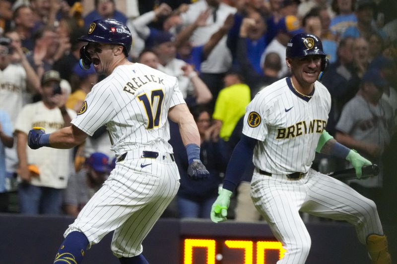 Milwaukee Brewers' Sal Frelick celebrates his home run with Joey Ortiz during the seventh inning of Game 3 of a National League wild card baseball game against the New York Mets Thursday, Oct. 3, 2024, in Milwaukee. (AP Photo/Morry Gash)