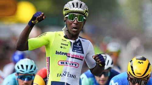 Eritrea's Biniam Girmay celebrates winning ahead of Colombia's Fernado Gavira, right, during the third stage of the Tour de France cycling race over 230.8 kilometers (143.4 miles) with start in Piacenza and finish in Turin, Italy, Monday, July 1, 2024. (AP Photo/Daniel Cole)