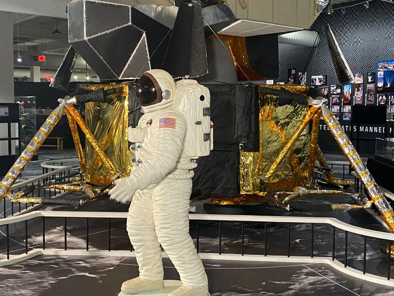 Outer space is showcased at the center of the museum with an eight-foot astronaut and a large replica of the Apollo 11 lunar lander in an exhibit dedicated to the 1969 moon landing and the technology that supported the mission.  Credit: Adrianne Murchison