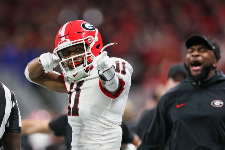 Georgia Bulldogs wide receiver Arian Smith (11) celebrates a catch against the Alabama Crimson Tide during the second half of the SEC Championship football game at the Mercedes-Benz Stadium in Atlanta, on Saturday, December 2, 2023. (Jason Getz / Jason.Getz@ajc.com)