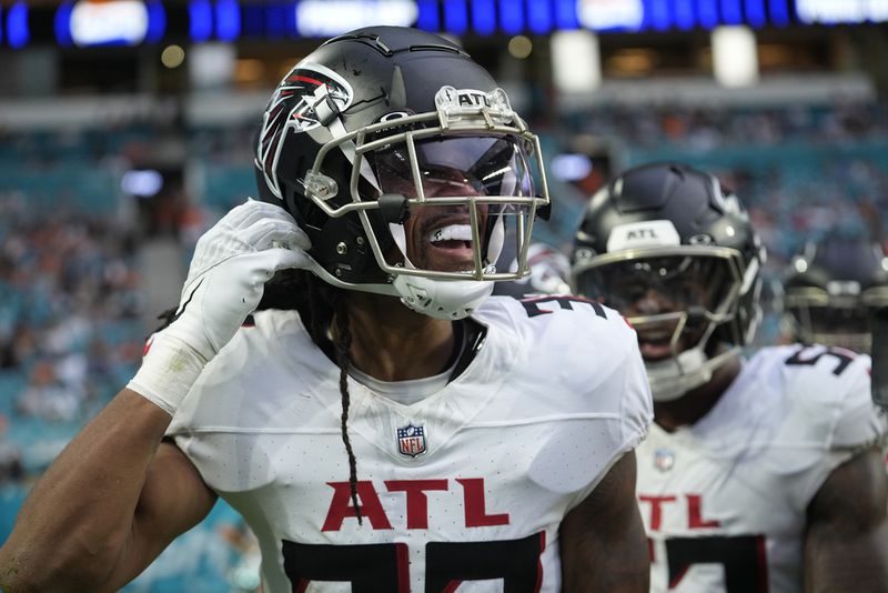 Atlanta Falcons cornerback Kevin King (32) celebrates an interception during the first half of a pre season NFL football game against the Miami Dolphins, Friday, Aug. 9, 2024, in Miami Gardens, Fla. (AP Photo/Lynne Sladky)