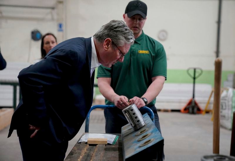 British Labour leader Sir Keir Starmer during a visit to C&W Berry's Builders Merchants, Lancashire, England, as he sets out his party's plans to create jobs through Labour's Green Prosperity Plan, while on the General Election campaign trail, Friday May 24, 2024. (Peter Byrne/PA via AP)