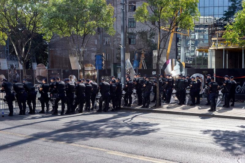 Serbian police officers cordon off a street during a pride march in Belgrade, Serbia, Saturday, Sept. 7, 2024. The march was held under heavy police protection because of possible attacks from right-wing extremists. (AP Photo/Marko Drobnjakovic)