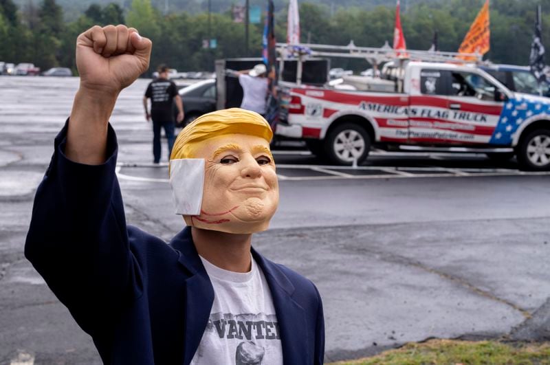 "Breakdancer for Trump" Victor Moon poses in a Donald Trump mask before campaign rally for Republican presidential nominee former President Trump at the Mohegan Sun Arena at Casey Plaza in Wilkes-Barre, Pa., Saturday, Aug. 17, 2024. (AP Photo/Laurence Kesterson)