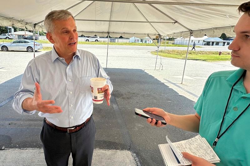 North Carolina Democratic gubernatorial candidate Josh Stein speaks with reporters outside Wilber's Barbecue in Goldsboro, N.C., on Wednesday, Aug. 21, 2024. (AP Photo/Gary D. Robertson)