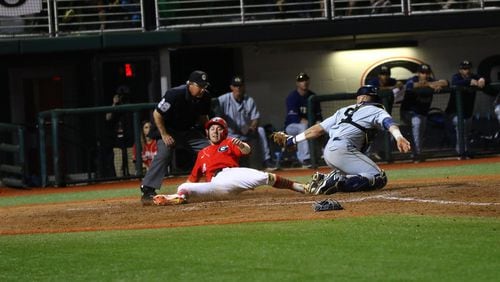 Georgia outfielder Tucker Bradley (28) is thrown out at home in the seventh inning of the Bulldogs' game against Georgia Tech at Foley Field in Athens, Ga. on Tuesday, April 3, 2018.