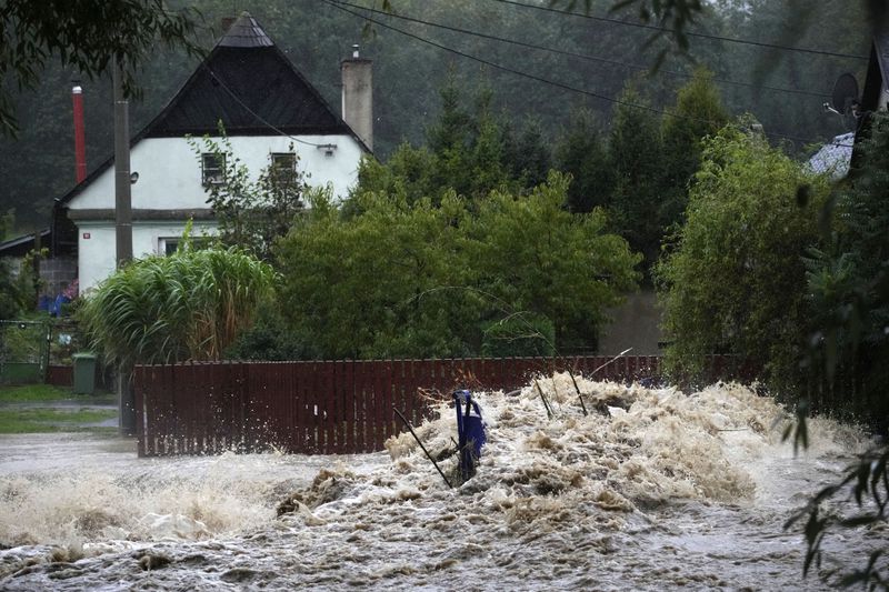 Debris collects on a small overpath on the Opavice River near Krnov, Czech Republic, Saturday, Sept. 14, 2024. (AP Photo/Petr David Josek)