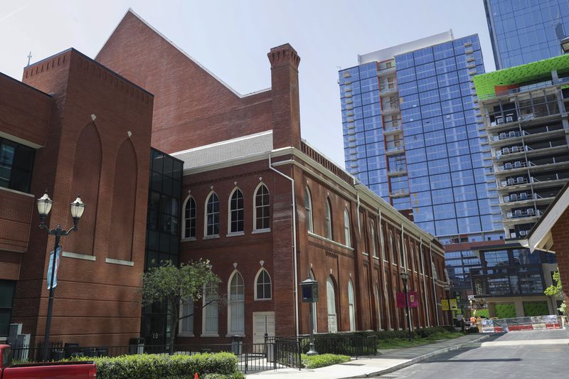 FILE - The Ryman Auditorium is surrounded by newer buildings in Nashville, Tenn., on April 16, 2020. (AP Photo/Mark Humphrey)