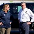 FILE- North Carolina Gov. Roy Cooper, right, and Deanne Criswell, Administrator of the U.S. Federal Emergency Management Agency, await the arrival of Democratic presidential nominee Vice President Kamala Harris for a briefing on the damage from Hurricane Helene, at Charlotte Douglas International Airport, Oct. 5, 2024, in Charlotte, N.C. (AP Photo/Chris Carlson, file)