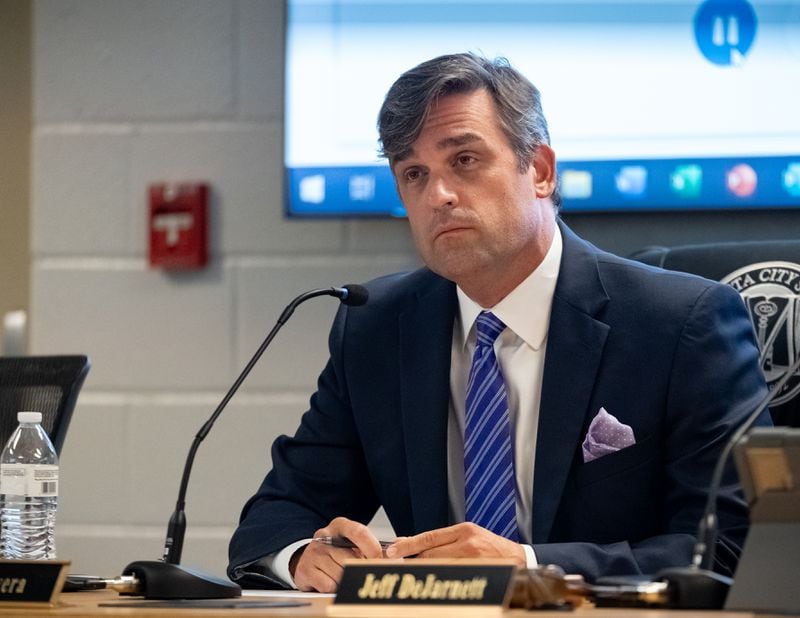 Marietta City Schools Superintendent Grant Rivera listens to public comment before the school board unanimously passed a ban on cellphones for middle school students during its June 18, 2024, meeting. (Ben Hendren for The Atlanta Journal-Constitution)