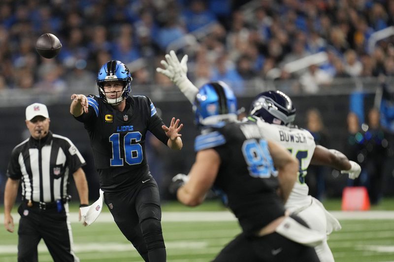 Detroit Lions quarterback Jared Goff (16) passes during the first half of an NFL football game against the Seattle Seahawks, Monday, Sept. 30, 2024, in Detroit. (AP Photo/Paul Sancya)