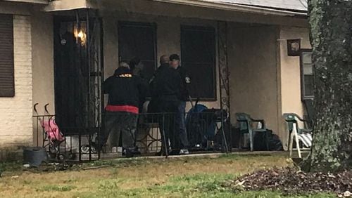 Police found the dog while executing search warrants on locations on Godby Road in South Fulton and Joan of Arc Place in College Park (pictured).