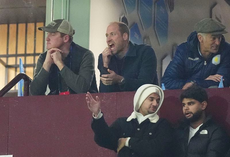 Britain's Prince William, centre, watches the Champions League opening phase soccer match between Aston Villa and Bayern Munich, at Villa Park in Birmingham, England, Wednesday, Oct. 2, 2024. (Mike Egerton/PA via AP)