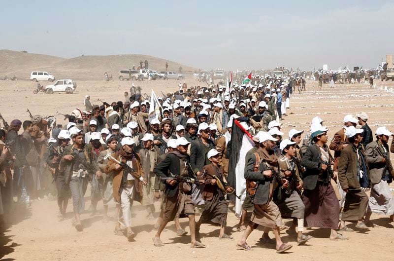 FILE - Houthi fighters march during a rally of support for the Palestinians in the Gaza Strip and against the U.S. strikes on Yemen outside Sanaa on Monday, Jan. 22, 2024. Thousands of fighters from Iran-backed groups in the Middle East are offering to come to Lebanon to join the militant Hezbollah group in its fight with Israel. (AP Photo, File)