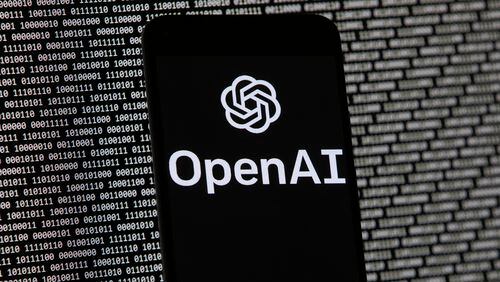 FILE - The OpenAI logo appears on a mobile phone in front of a computer screen with random binary data, March 9, 2023, in Boston. San Francisco-based OpenAI said Thursday, July 25, 2024, it is releasing a preview of the SearchGPT to a small group of users and publishers for feedback. (AP Photo/Michael Dwyer, File)