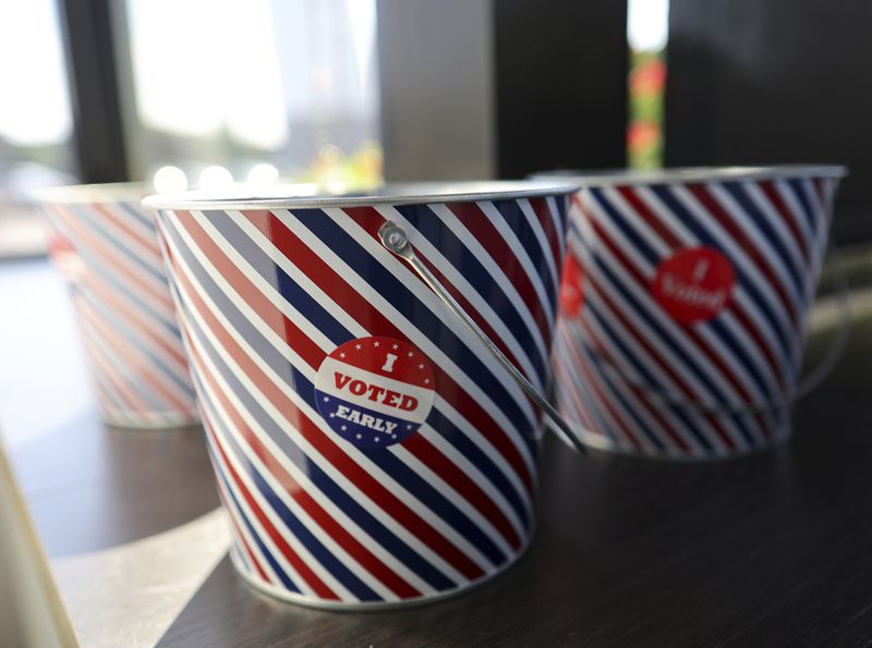 "I Voted Early" stickers sit in a bucket by the ballot box at the City of Minneapolis early voting center, Thursday, Sept. 19, 2024, in St. Paul, Minn. In-person voting in the 2024 presidential contest begins Friday in three states, including Democratic vice presidential candidate Tim Walz's home state of Minnesota, with just over six weeks left before Election Day. (AP Photo/Adam Bettcher)