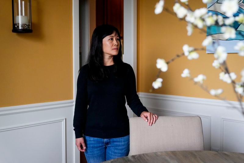 Ellen Lo Hoffman, the co-founder of Soul Reparations, a nonprofit providing free spiritual support to women, poses for a portrait at her home Wednesday, Aug. 21, 2024, in Bothell, Wash. (AP Photo/Lindsey Wasson)