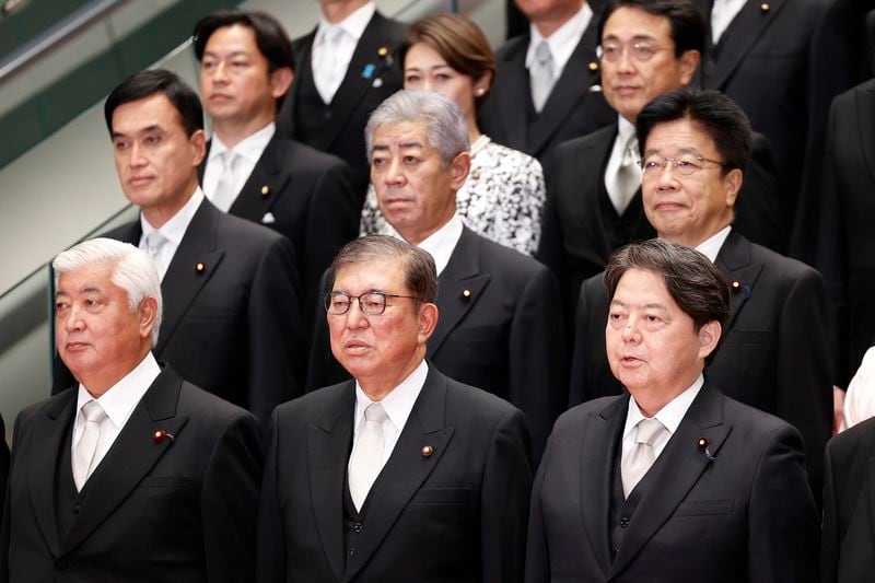 Japan's Prime Minister Shigeru Ishiba, center, and his cabinet ministers pose for a photo session at Ishiba's residence in Tokyo, Japan, Tuesday, Oct. 1, 2024. Rodrigo Reyes Marin, Pool Photo via AP)