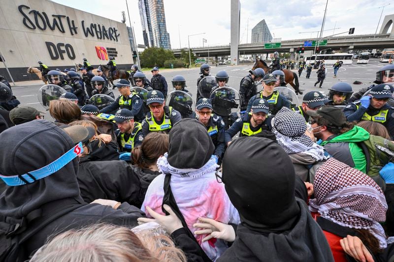 Victoria Police clash with anti-war protesters outside a military arms convention in downtown Melbourne, Australia,Wednesday, Sept. 11, 2024. (Joel Carrett/AAP Image via AP)