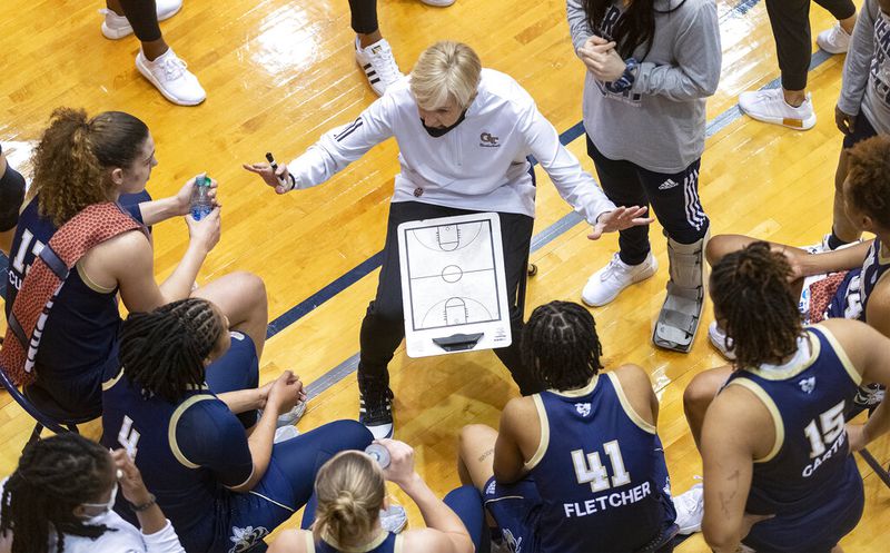 Georgia Tech coach Nell Fortner talks with players during a timeout in the second half of the team's college basketball game against West Virginia in the second round of the NCAA women's tournament at the UTSA Convocation Center in San Antonio on Tuesday, March 23, 2021. (AP Photo/Stephen Spillman)