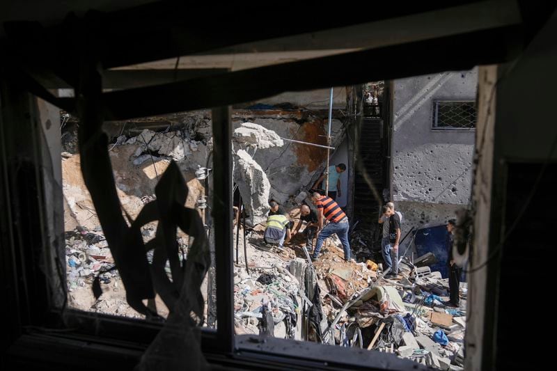 Palestinians inspect the destruction following an Israeli operation in Nur Shams refugee camp, near the West Bank town of Tulkarem, Sunday, June 30, 2024. Palestinian health officials said one person was killed and several wounded during an Israeli operation in the Nur Shams refugee camp in the northern West Bank. Israel frequently operates in the area, saying it is a stronghold of Palestinian militants. (AP Photo/Majdi Mohammed)