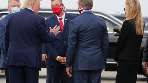 U.S. Rep. Rick Allen of Evans, far left, and U.S. Sen. Kelly Loeffler, far right, will attend in person President Donald Trump's speech Thursday from the White House to the Republican National Convention. U.S. Rep. Doug Collins of Gainesville, with red face covering, will not make it, nor will U.S. Sen. David Perdue, second from left, who recently underwent knee surgery. (Curtis Compton/Atlanta Journal-Constitution/TNS)