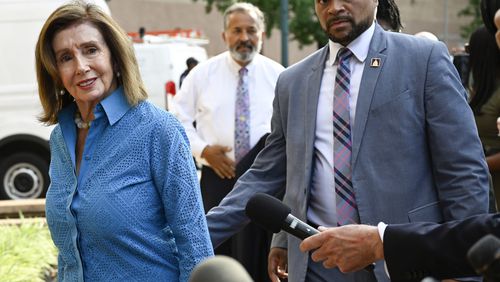 Rep. Nancy Pelosi, D-Calif., the speaker emerita, left, arrives at the Democratic National Headquarters with other Democratic members of the House of Representatives to discuss the future of President Biden running for the presidency, Tuesday, July 9, 2024 in Washington. (AP Photo/John McDonnell)