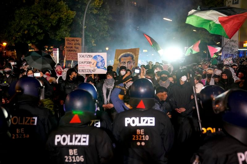 People take part in a pro-Palestinian rally in Berlin, Germany, Monday, Oct. 7, 2024. (AP Photo/Ebrahim Noroozi)