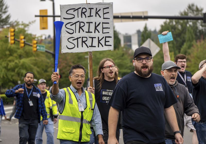 International Aerospace Machinists union members march toward the union's hall to vote on a contract offer with airplane maker Boeing, on Thursday, Sept. 12, 2024, in Renton, Wash. (AP Photo/Stephen Brashear)