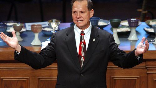 Suspended Alabama Chief Justice Roy Moore speaks to parishoners at The Church of the Apostles September 7, 2003 in Atlanta, Georgia. Moore's Ten Commandments monument was recently removed from the Alabama Judicial Building in Montgomery, Alabama. (Photo by Erik S. Lesser/Getty Images)