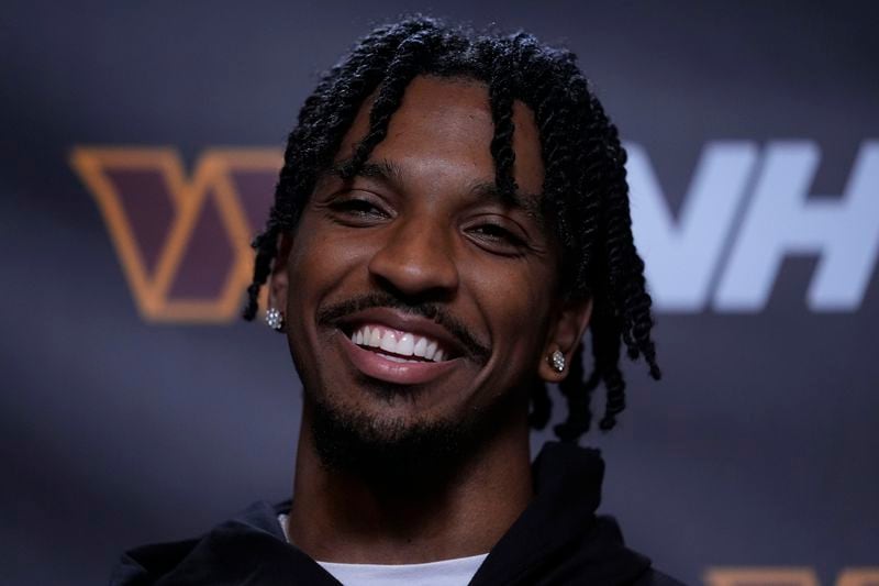 Washington Commanders quarterback Jayden Daniels speaks during a news conference after an NFL football game against the Cincinnati Bengals, Monday, Sept. 23, 2024, in Cincinnati. The Commanders won 38-33. (AP Photo/Carolyn Kaster)