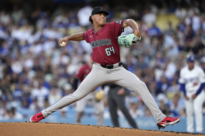 Arizona Diamondbacks starting pitcher Cristian Mena throws to the plate during the first inning of a baseball game against the Los Angeles Dodgers Wednesday, July 3, 2024, in Los Angeles. (AP Photo/Mark J. Terrill)
